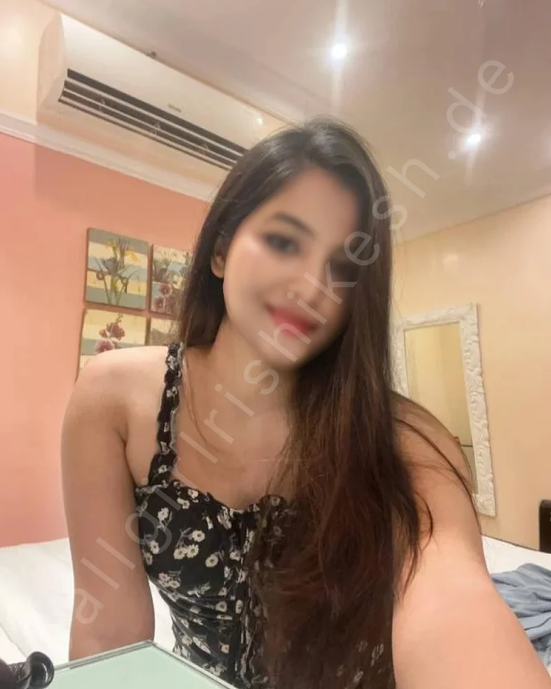 College Call Girl wearing black printed top and taking selfiee in hotel room in rishikesh 